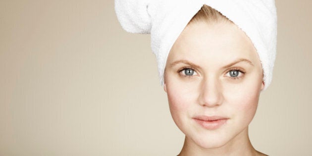 Woman with her hair wrapped in a towel