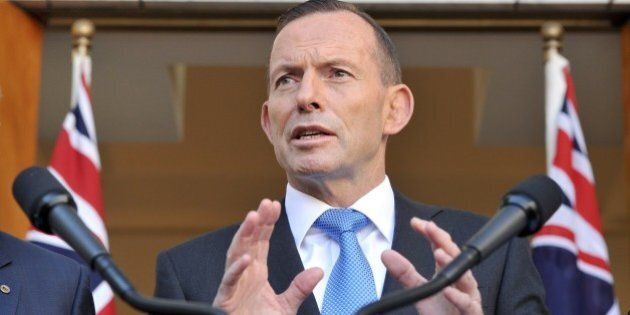 Australian Prime Minister Tony Abbott speaks to the media during a press conference at Parliament House in Canberra on September 9, 2015. Australia will take an extra 12,000 refugees in response to the humanitarian crisis in the Middle East, Abbott said, confirming Canberra would join coalition air strikes against Islamic State group in Syria. AFP PHOTO / MARK GRAHAM (Photo credit should read MARK GRAHAM/AFP/Getty Images)