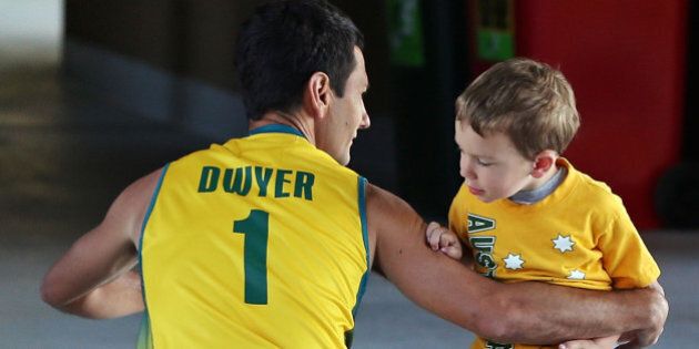 MELBOURNE, AUSTRALIA - DECEMBER 02: Jamie Dwyer of Australia says goodbye too his son Julian Dwyer before his match during day two of the Champions Trophy on December 2, 2012 in Melbourne, Australia. (Photo by Michael Dodge/Getty Images)