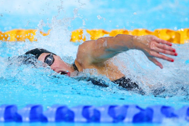 Laura competes in the Women's 4 x 100m Freestyle Relay Final at Tollcross International Swimming Centre during day one of the Glasgow 2014 Commonwealth Games on July 24, 2014 in Glasgow, Scotland.