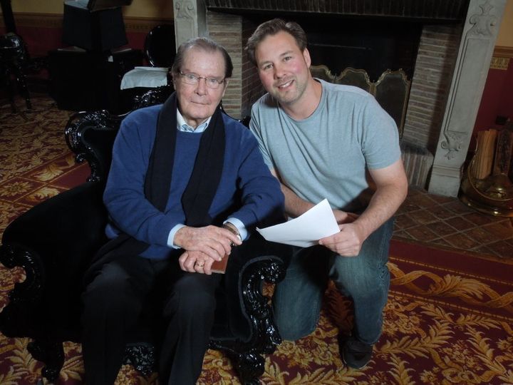 FIlmmaker Andrew Lumley with James Bond royalty Sir Roger Moore.