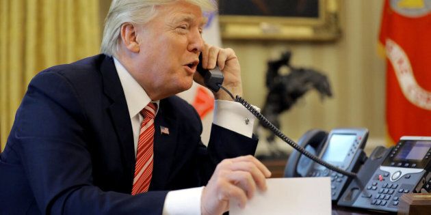 U.S. President Donald Trump congratulates Prime Minister Leo Varadkar of Ireland during a phone call from inside the Oval Office of the White House in Washington, U.S., June 27, 2017. REUTERS/Carlos Barria