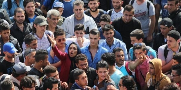 ISTANBUL, TURKEY - SEPTEMBER 15: Syrian refugees try to get the Istanbul bus terminal to go to Germany through Greece in Istanbul, Turkey on September 15, 2015. (Photo by Isa Terli/Anadolu Agency/Getty Images)