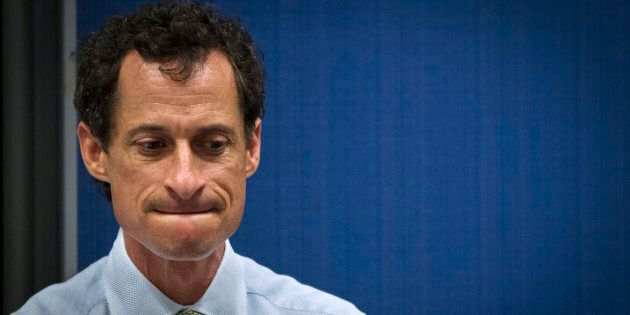 Former U.S. congressman from New York and current democratic candidate for New York City Mayor Anthony Weiner listens to fellow candidates speak at a debate held at the Museum of Tolerance in New York August 14, 2013. REUTERS/Lucas Jackson (UNITED STATES - Tags: POLITICS)