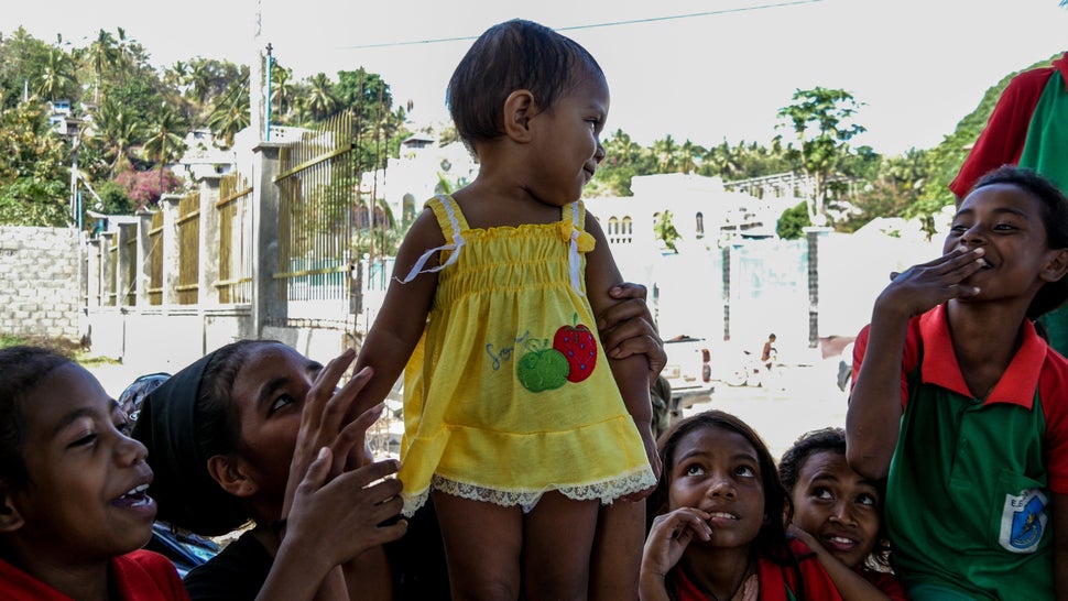 Spot the favourite. This gorgeous girl is adored by her siblings and friends. Baucau, Timor-Leste.