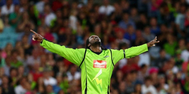 SYDNEY, AUSTRALIA - DECEMBER 30: Chris Gayle of the Thunder celebrates taking the wicket of Moises Henriques of the Sixers during the Big Bash League match between Sydney Thunder and the Sydney Sixers at ANZ Stadium on December 30, 2012 in Sydney, Australia. (Photo by Mark Kolbe/Getty Images)