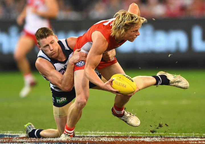 Looks like a surfie... plays like a champ. Isaac Heeney gets the better of the Cats' Mark Blicavs.