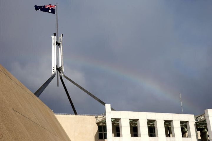 A rainbow flies over Parliament House in Canberra.