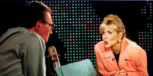 Gennifer Flowers blows a kiss to Larry King during an interview. Former President Bill Clinton admitted to having an affair with Flowers while he was governor of Arkansas.