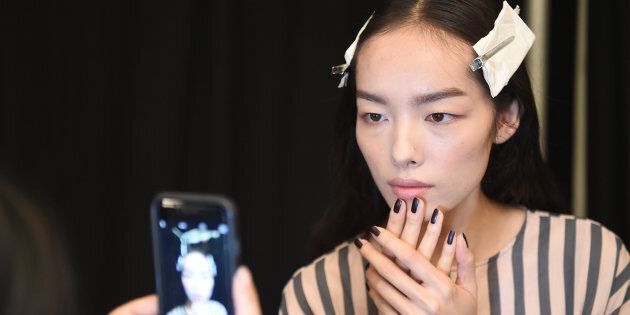 NEW YORK, NY - SEPTEMBER 13: A model prepares backstage at the Vera Wang Collection fashion Show during New York Fashion Week: The Shows at The Arc, Skylight at Moynihan Station on September 13, 2016 in New York City. (Photo by Nicholas Hunt/Getty Images for New York Fashion Week: The Shows)