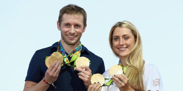 RIO DE JANEIRO, BRAZIL - AUGUST 17: Team GB cyclists Laura Trott and Jason Kenny pose with their gold medals at Adidas House on August 17, 2016 in Rio de Janeiro, Brazil. (Photo by Bryn Lennon/Getty Images)