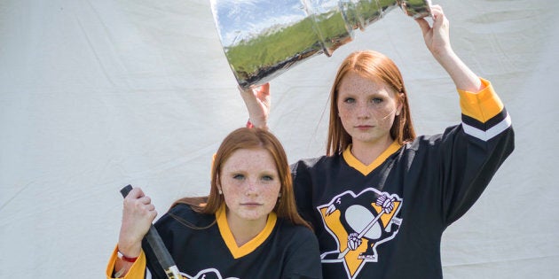 Arnette (left) and Anette Avery have their picture taken at the Twinsburg Twins Days Festival on Aug. 4.