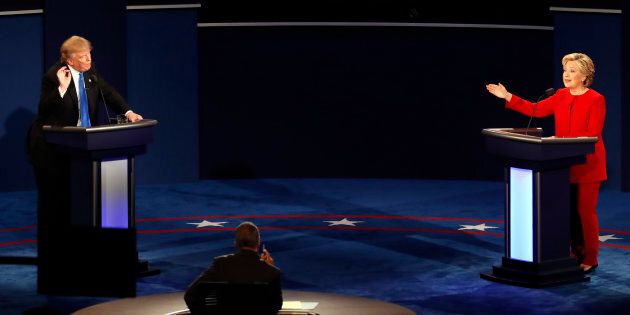 Republican presidential nominee Donald Trump and Democratic presidential nominee Hillary Clinton gesture during the presidential debate in New York.