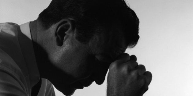 1950s SOLITARY ANONYMOUS DEPRESSED SAD WORRIED SILHOUETTED MAN HEAD DOWN HAND TO FOREHEAD (Photo by H. Armstrong Roberts/ClassicStock/Getty Images)