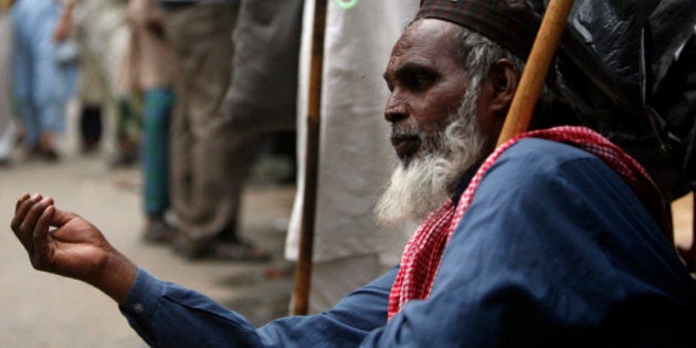 A blind man begs on a street in New Delhi, India, Wednesday, Aug. 26, 2009. Large pockets of extreme poverty and hunger persist in Asia, where the global downturn makes it more difficult to achieve U.N. goals to reduce the ranks of the poor, the Asian Development Bank said Wednesday. In 19 Asian economies, including the most populous China and India, more than 10 percent of people live on less than $1.25 a day and more than 10 percent are malnourished. (AP Photo/Mustafa Quraishi)