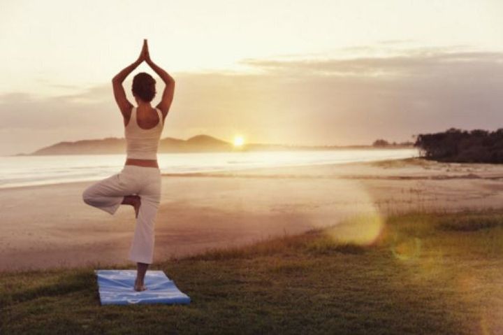 Do yoga at the quiet end of Clarkes beach at Elements of Byron.