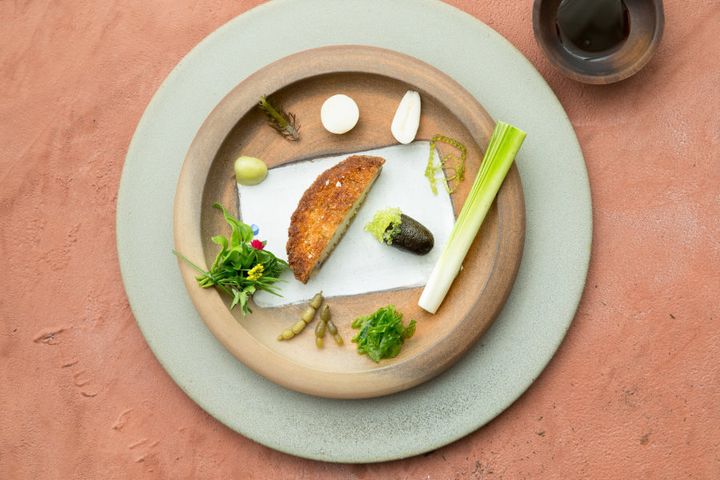 Noma used Australian ingredients like this crumbed abalone with native seaweeds and bunya nuts.