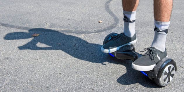 Logan Meis, 20, balances on his hover board outside his apartment complex in Overland Park, Kan., on Friday, Sept. 4, 2015. Meis purchased the personal transportation device for about $330 online. (Tammy Ljungblad/Kansas City Star/TNS via Getty Images)