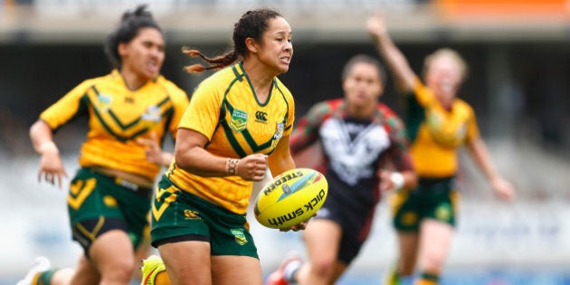 AUCKLAND, NEW ZEALAND - JANUARY 31: Jenni-Sue Hoepper of Australia runs in a try during the match between New Zealand and Australia in the 2015 Auckland Nines at Eden Park on January 31, 2015 in Auckland, New Zealand. (Photo by Phil Walter/Getty Images)