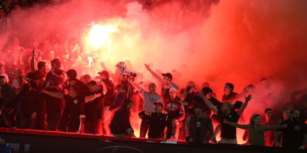 GOSFORD, AUSTRALIA - APRIL 11: Western Sydney wanderers fans let off flares during the round 25 A-League match between the Central Coast Mariners and the Western Sydney Wanderers at Central Coast Stadium on April 11, 2015 in Gosford, Australia. (Photo by Tony Feder/Getty Images)