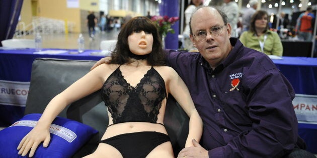 Engineer-inventor Douglas Hines poses with Roxxxy at the AVN Adult Entertainment Expo in Las Vegas, Nevada.