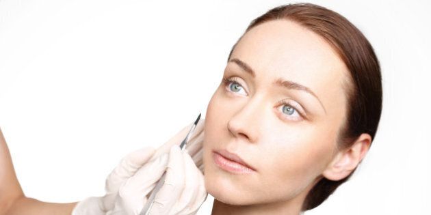 Plastic surgery, a woman in the clinic of aesthetic surgery