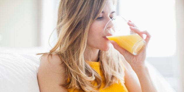 Woman drinking orange juice