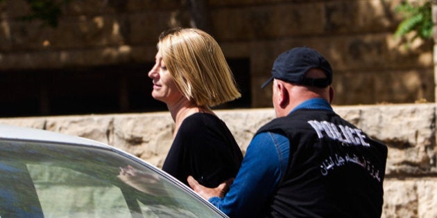 BEIRUT, LEBANON - APRIL 18: TV presenter Tara Brown is escorted from court on April 18, 2016 in Beirut, Lebanon. Australian mother Sally Faulkner, a four-person '60 Minutes' TV crew and two men from British company 'Child Abduction Recovery International' face abduction charges in a Beirut court. All parties were arrested on April 7 following a failed attempt to reunite Faulkner with her two children, taken to Lebanon by her estranged husband. (Photo by Diego Ibarra Sanchez/Getty Images)