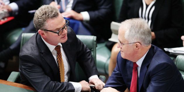 CANBERRA, AUSTRALIA - FEBRUARY 11: Minister for Industry, Innovation and Science Christopher Pyne speaks with Prime Minister Malcolm Turnbull during House of Representatives question time at Parliament House on February 11, 2016 in Canberra, Australia. Nationals Leader and Deputy Prime Minister Warren Truss and Trade Minister Andrew Robb will retire at the next election. (Photo by Stefan Postles/Getty Images)