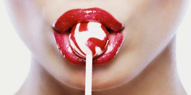 Woman Eating Lollipop