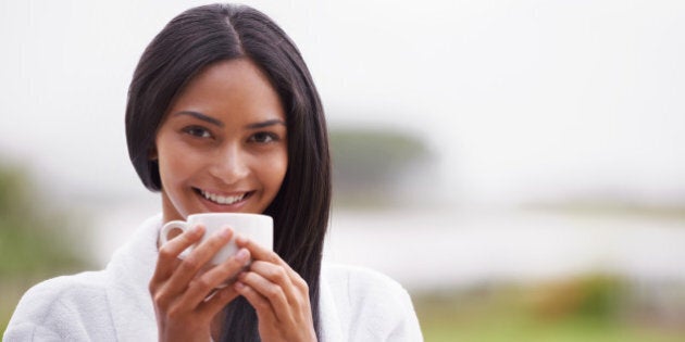 A beautiful young woman enjoying a cup of coffee while wearing a bathrobehttp://195.154.178.81/DATA/i_collage/pi/shoots/783160.jpg