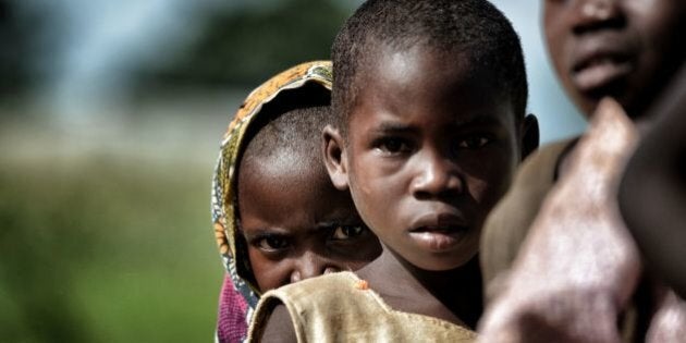 Children are pictured in the outskirts of Lilongwe on March 11, 2016. / AFP / ARIS MESSINIS / RESTRICTED TO EDITORIAL USE (Photo credit should read ARIS MESSINIS/AFP/Getty Images)