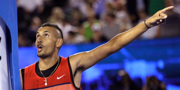 Nick Kyrgios of Australia gestures as he argues with the umpire during his third round match against Tomas Berdych of the Czech Republic at the Australian Open tennis championships in Melbourne, Australia, Friday, Jan. 22, 2016.(AP Photo/Aaron Favila)