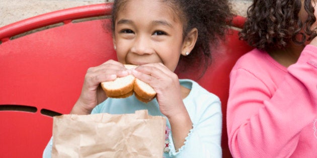 Girl eating lunch at recess