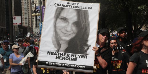 CHICAGO, IL - AUGUST 13: A demonstrator carries a sign remembering Heather Heyer during a protest on August 13, 2017 in Chicago, Illinois. Heyer was killed and 19 others were injured yesterday in Charlottesville, Virginia when a car plowed into a group of activists who were preparing to march in opposition to a nearby white nationalist rally. Two police officers were also killed when a helicopter they were using to monitor the rally crashed. (Photo by Scott Olson/Getty Images)