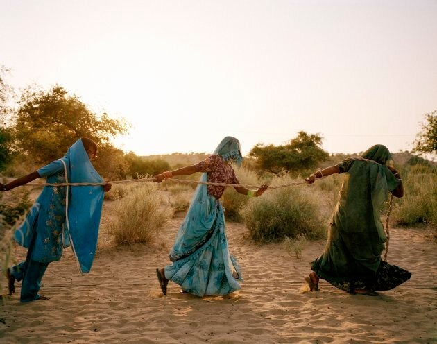 Women pull water from a well in the Thar Desert, where temperatures hover between 48°C and 50°C on summer days.