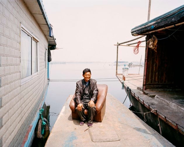 Wang's whole family has lived on boats on Lake Hong for generations. Since work began to restore the lake wetland reserve in 2002, Wang and his family have seen it transformed from being dirty and polluted through unsustainable fishing practices to the cleaner lake it is today.