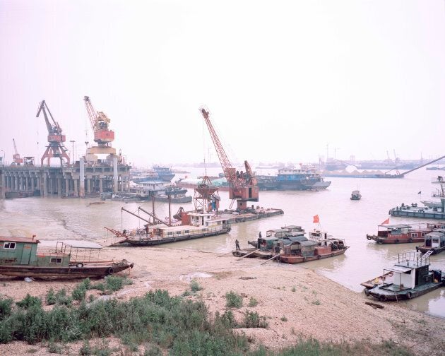 Large ships dominate the landscape of China's second-largest freshwater lake. The ships are used to transport sand and other industrial goods such as fertiliser.