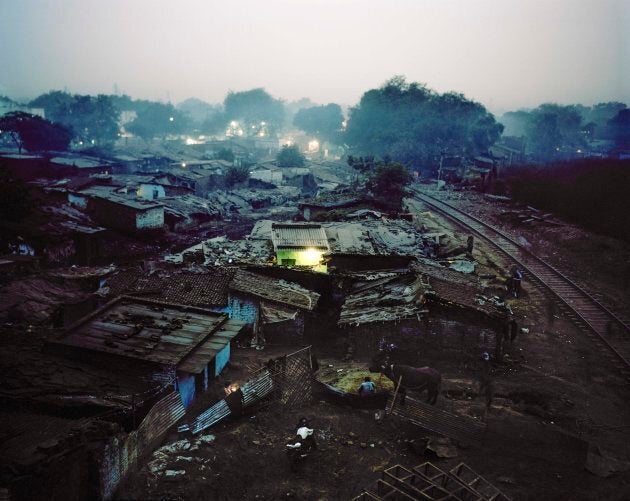 The Rakhi Mandi slum is located on a landfill site next to a busy railway line. Residents of informal settlements like this often lack the legal right to build permanent structures such as toilets, even if they have the means and ability to do so.