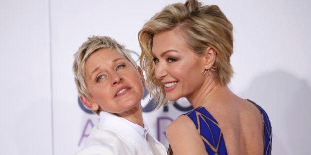 TV personality Ellen DeGeneres arrives with her spouse, actress Portia di Rossi (R), at the 2015 People's Choice Awards in Los Angeles, California January 7, 2015. REUTERS/Danny Moloshok (UNITED STATES - Tags: ENTERTAINMENT) (PEOPLESCHOICE-ARRIVALS)