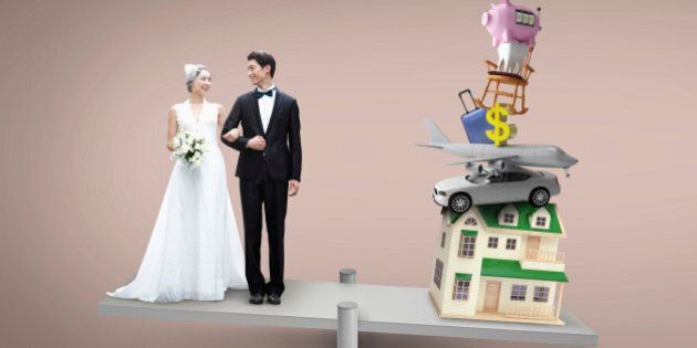 a couple getting married next to a pile of items