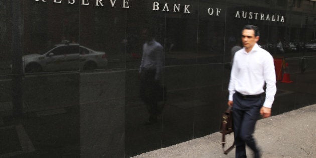 A pedestrian walk past the Reserve Bank of Australia headquarters in Sydney, Australia, on Monday, Feb. 29, 2016. Australian wage rises are the smallest on record, jobs growth has evaporated and firms plan to cut investment. Add a stronger currency and global calls for stimulus and pressure is clearly building for interest-rate cuts. Photographer: Brendon Thorne/Bloomberg via Getty Images