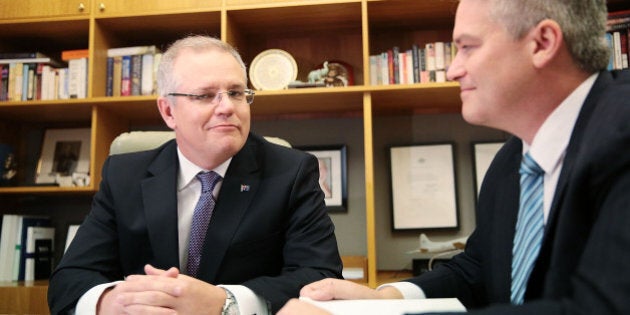 CANBERRA, AUSTRALIA - MAY 03: Treasurer Scott Morrison and Minister for Finance Mathias Cormann pose with the 2016 Federal Budget papers in the Treasurers office at Parliament House on May 3, 2016 in Canberra, Australia. The Coalition government will deliver the 2016 federal budget tonight, and is expected to announce changes to the tax system for individuals and business as well as changes to superannuation. (Photo by Stefan Postles/Getty Images)