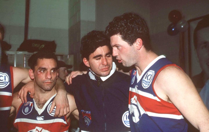 Tony Liberatore, Jose Romero and Rohan Smith of the Western Bulldogs were not exactly in party mode afterwards.