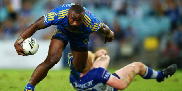 SYDNEY, AUSTRALIA - APRIL 29: Semi Radradra of the Eels runs over James Graham of the Bulldogs during the round nine NRL match between the Parramatta Eels and the Canterbury Bulldogs at ANZ Stadium on April 29, 2016 in Sydney, Australia. (Photo by Mark Nolan/Getty Images)