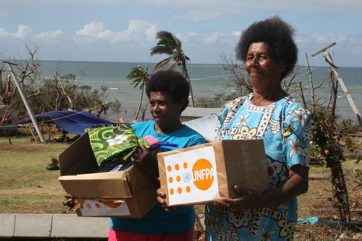 Ms. Udite Wati and daughter Fulori from Lolomolevu Settlement, Silina in Dawasamu, receiving Dignity Kits in response to Tropical Cyclone Winston.