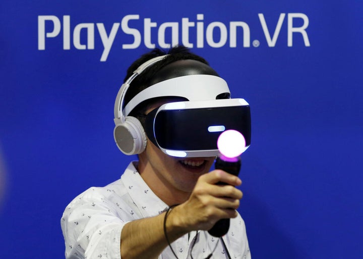 A man plays a video game with Sony's PlayStation VR headset at Tokyo Game Show 2016 in Makuhari, east of Tokyo, Japan, in Mid September.