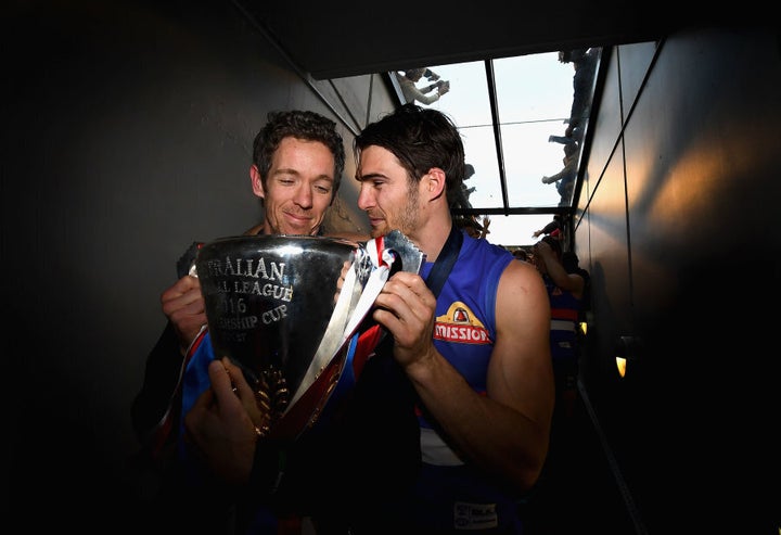 Skipper and skipper. Murphy and Wood share a quiet moment with the premiership cup.