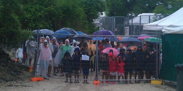 Protesters stand outside Nauru detention centre in April.