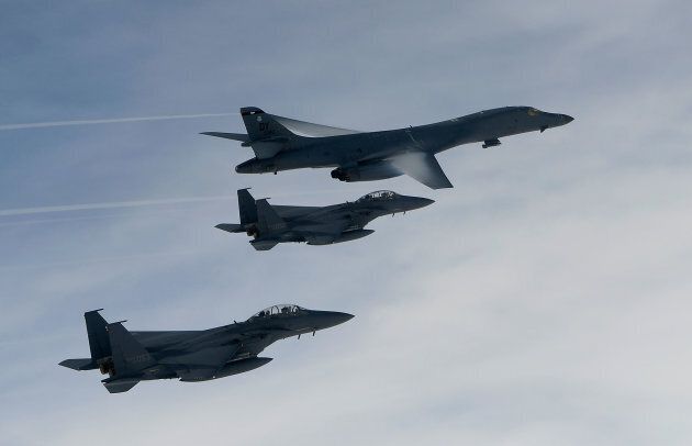 In this handout photo released by the South Korean Defense Ministry, A U.S. Air Force B-1B Lancer bomber (top) fly with South Korean jets over the Korean Peninsula during a South Korea-U.S. joint live fire drill on July 8, 2017 in Korean Peninsula, South Korea.